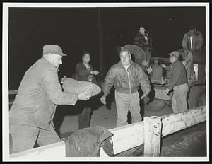 Taunton Morey Dam. Truckload of sandbags unloading sand for dam