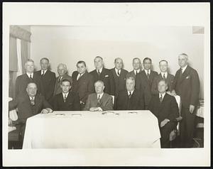 National League Club Owners in Chicago Meeting. This group of National League club owners and officials was photographed in Chicago Dec. 12 at the winter base ball meeting. Seated, left to right; WM. Walker, Chicago; Phil Wringley, Chicago; John Heydler, president of the National League; Chas. Stoneham, New York; Sam Breardon, St. Louis; Standing, left to right: Bob Quinn, Brooklyn; Chas. Weberm Chicago; John Seys, Chicago Emil Fuchs, Boston; James J. Tierney, New York; T.M. Conroy, Cincinnati; James Gilleaudeau, Brooklyn; Leo Bondy, New York; WM. Benswanger, Pittsburgh and G.P. Nugent, Philadelphia.