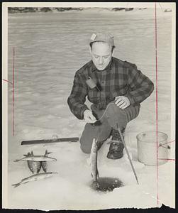 Fisherman's Luck is pretty good for Rolland Bellisle of Manchester, N.H., having a big day with pickerel while ice fishing at Lake Winnipesaukee.