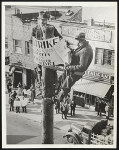 Sit-Downers Sit Up. Sitting-down Sit-downers are getting to be an old story, but it's news when sit-downers sit up. Here are two atop a pole in New York City today (Nov.1). They are employes of the Consolidated Edison Co. at Flushing, L.I. Three sat on adjoining poles. They were protesting against reported firing of several hundred employes.