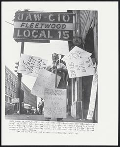 Detroit – He’s Set For Auto Strike – Conrad Silveri, member of Local 15, United Auto Workers, holds an armful of strike signs the local was preparing today. The UAW has called for a strike of General Motors workers for 10 A.M. Wednesday unless a settlement can be reached in a new contract negotiation.