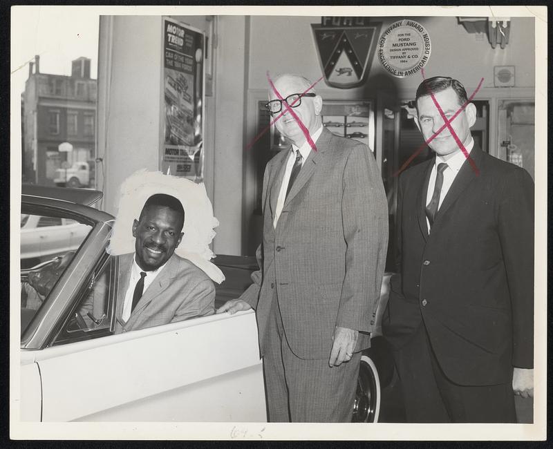 Left to Right: Bill Russel, Salesman; Abe Maltz, President: and Sid Braveman, sales manager, of Eliot Ford, Roxbury.