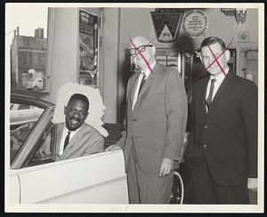 Left to Right: Bill Russel, Salesman; Abe Maltz, President: and Sid Braveman, sales manager, of Eliot Ford, Roxbury.