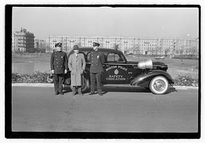 Policemen standing next to Boston Police Safety Education vehicle, Back Bay Fens