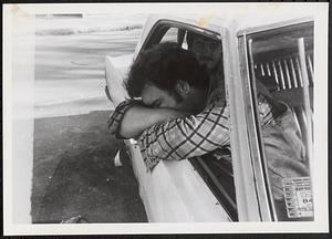 Man sleeping in a car