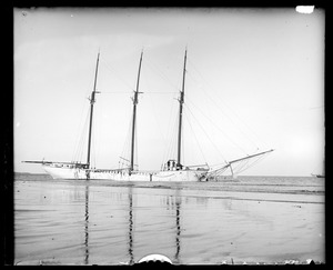 Three-masted schooner at wharf