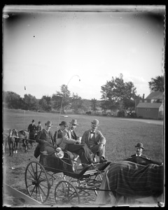 Men in horse-drawn carriage