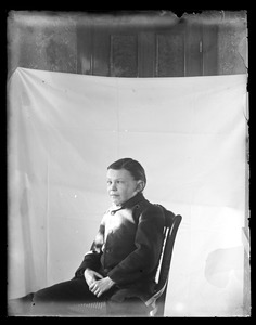 Unidentified person sitting in chair