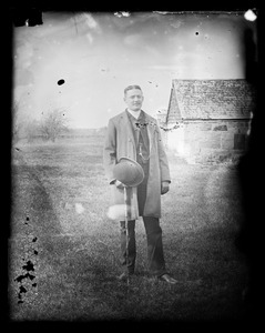 Unidentified man standing in field