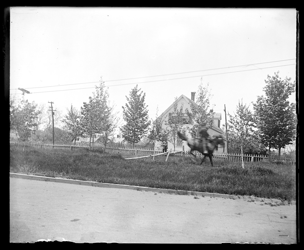 Unidentified man on horse in motion