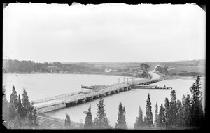 Unidentified scene- body of water with piers/docks