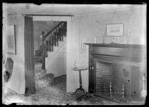 Interior of home showing staircase and fireplace