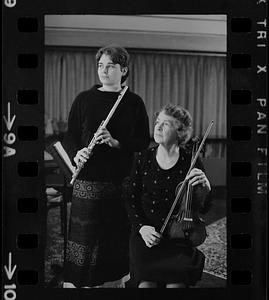 Florence Chapman Pearson seated with violin and Lea Pearson with flute