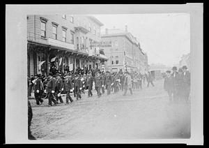 Parade of Civil War veterans, turning from South Main St. onto Pond St. in front of Walcott block