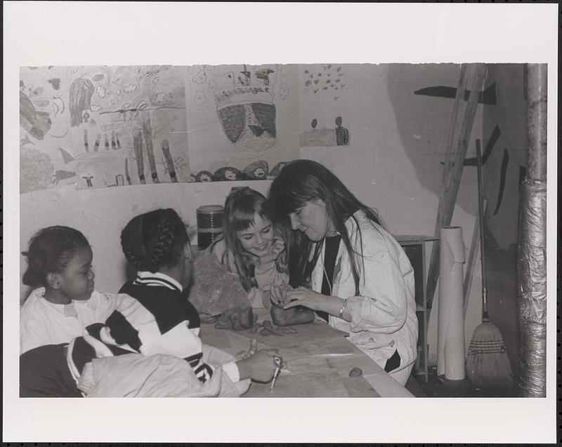 Teacher teaching a clay class