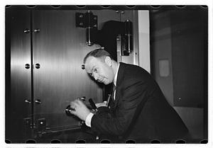 A man demonstrating how to break into a safe