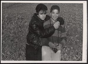 Priscilla with Kymio Postell holding a camera