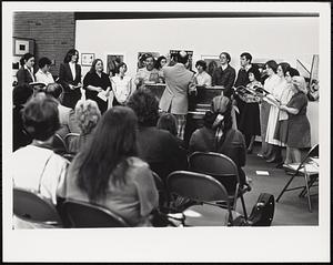 Choral performance before an audience in the GCC art gallery