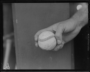 Non-Boston and unidentified baseball in hand