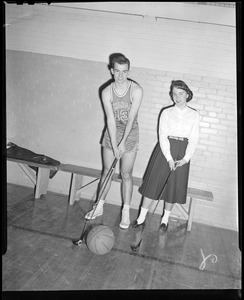 Framingham High School player poses with girl and golf club