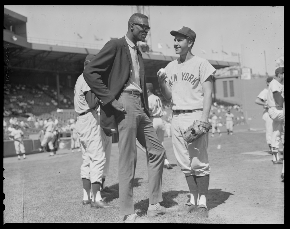 Bill Russell talking with Yankee player at Fenway Park