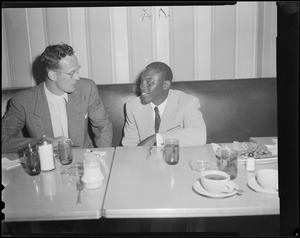 Jimmy Carter in Boston to fight "Bud" Smith at the Boston Garden, talking with Bruins defenseman Hal Laycoe at "Ye Garden Café"