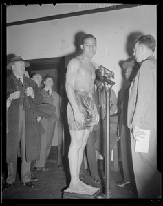 Joe Louis weighs in before McCoy fight at the Garden