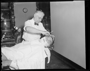 Jack Dempsey getting a shave at the Hotel Touraine