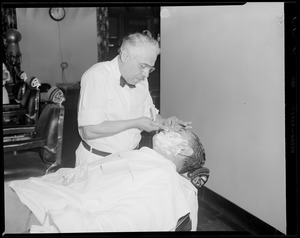Jack Dempsey getting a shave at the Hotel Touraine