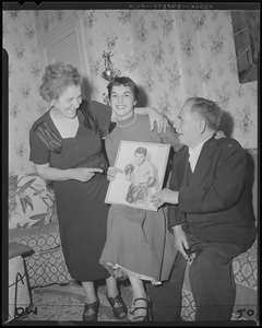 Tony DeMarco's parents and his fiancée admire his photograph at Tony's Fleet Street home