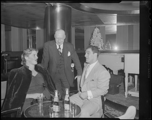 Rocky Marciano and wife have a cocktail