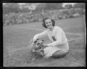 Cheerleader with "W" on her sweater with bulldog mascot