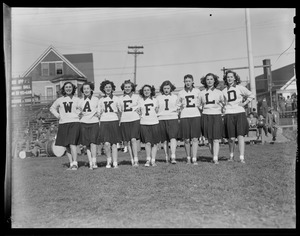 Wakefield cheerleaders spell out "Wakefield" with sweaters