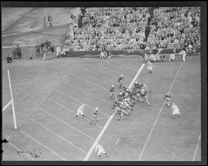 Tony Gianelly, no. 34, follows Leo Daley for Harvard's first score in 4th in comeback over Yale, 13-9