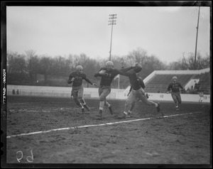 Joe Sheehan, B.C. High, straight arms Sid Goldstein of Roxbury Memorial on way to Eaglets 18-6 win