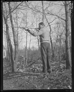 "Jug" McSpaden with shotgun, at home in Arlington