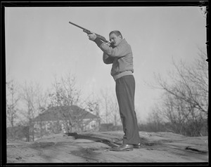 "Jug" McSpaden with shotgun, at home in Arlington