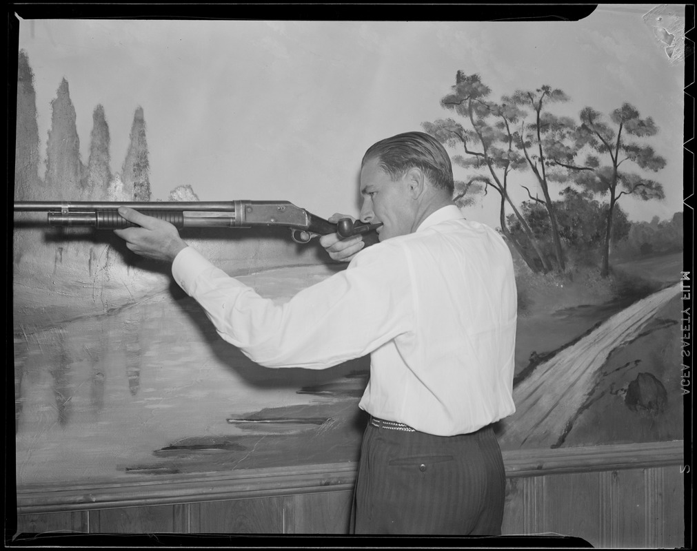 "Jug" McSpaden with shotgun, at home in Arlington