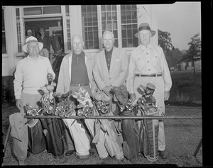 Four old timers at the bag rack
