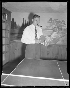 "Jug" McSpaden playing ping pong at home, Arlington