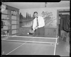"Jug" McSpaden playing ping pong at home, Arlington