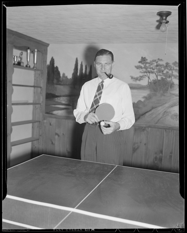 "Jug" McSpaden playing ping pong at home, Arlington