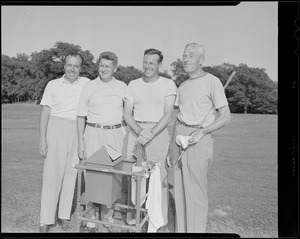 Golfers with ball washing machine