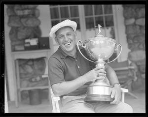 Man holds Rhode Island Open trophy