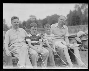 Two golfers and two boys