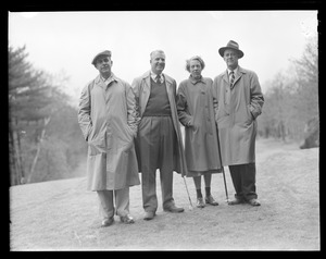Three men and woman on the course