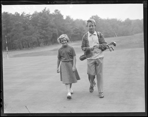 Boy and girl golfers