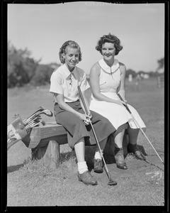 Two women take a break on the course