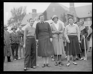Four women golfers