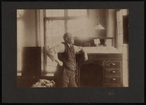 Man in Profile Leaning on his Work Desk